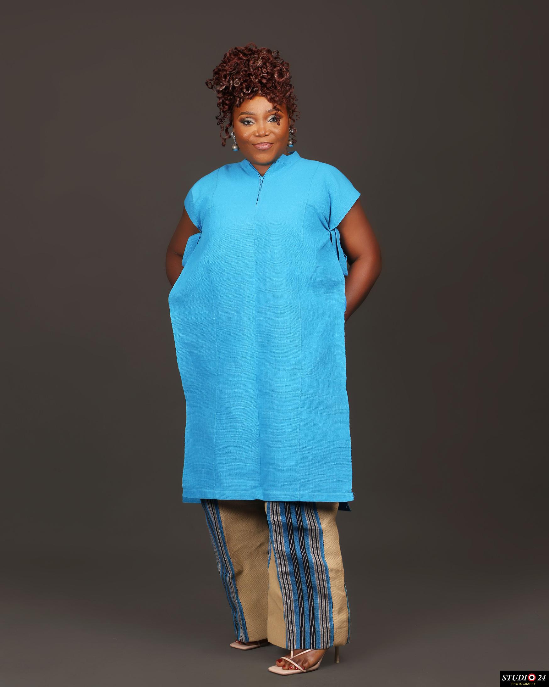 Temitope Van-Lare in a full length blue outfit